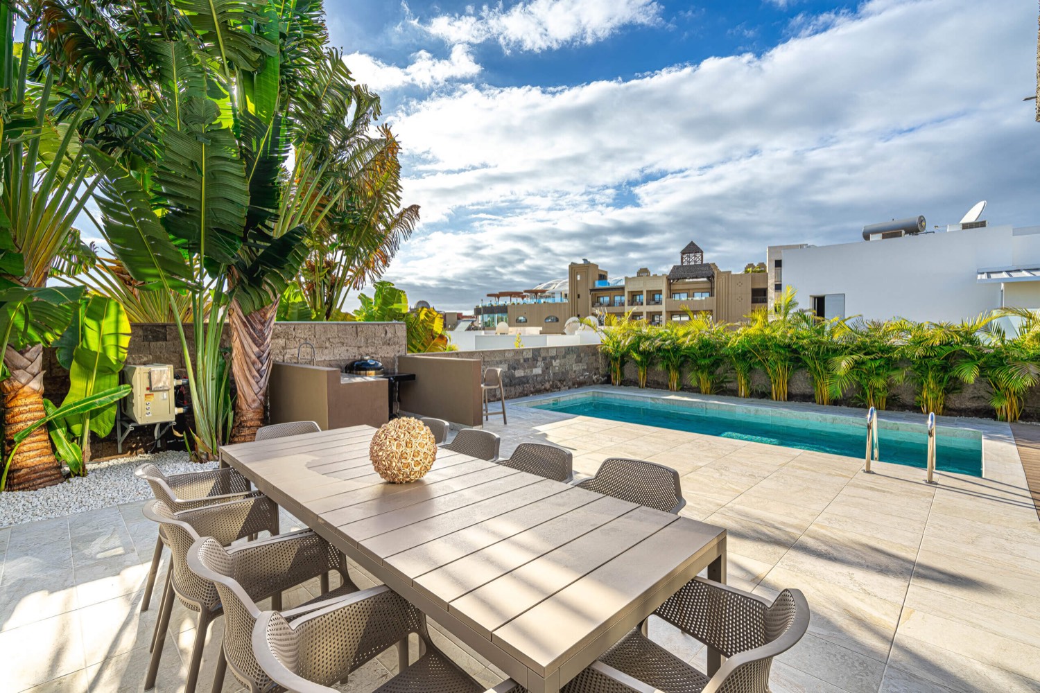 Outdoor dining and living area at Villa 32