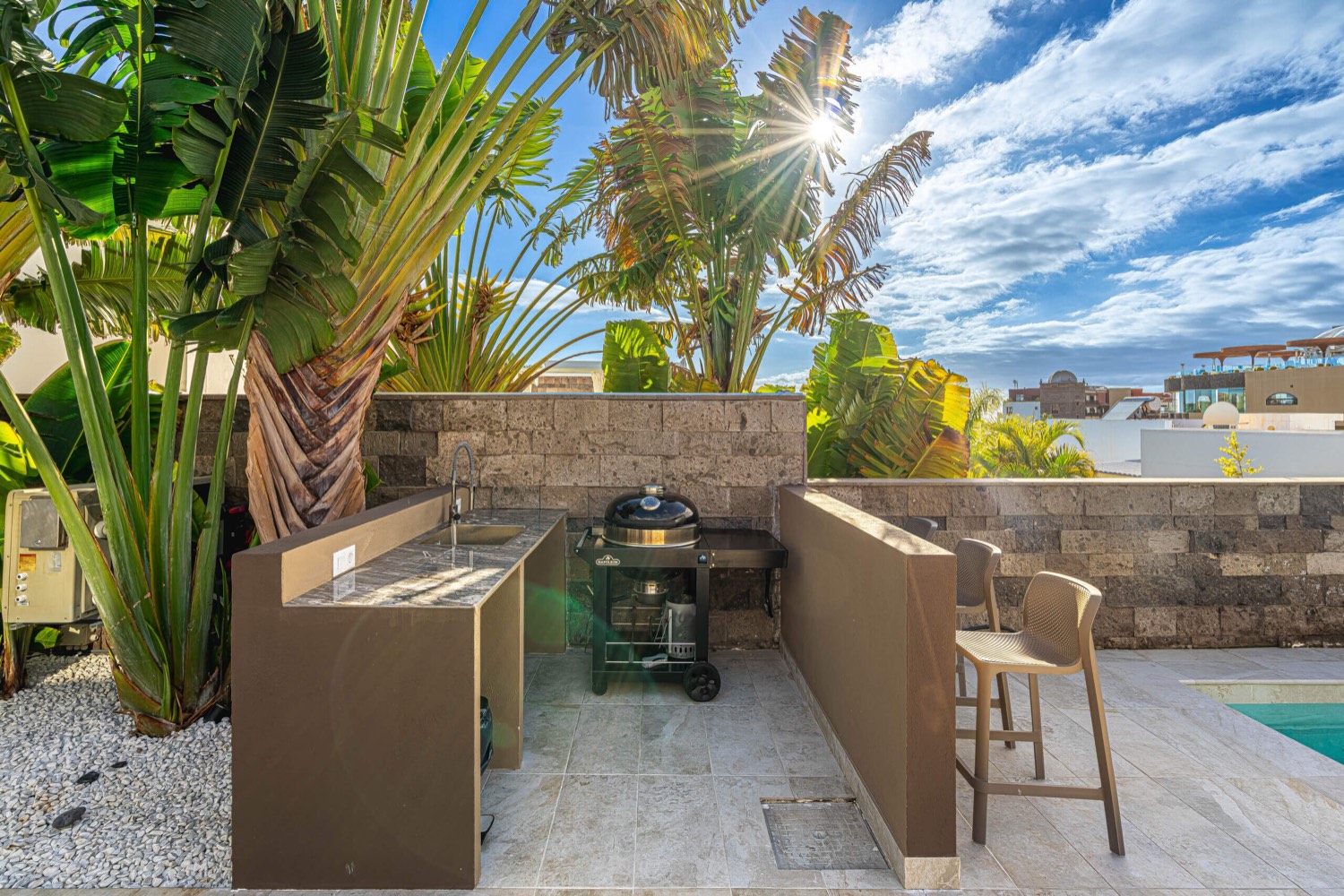 Barbecue area beside the pool at Villa 32