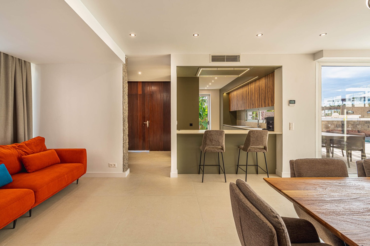 Open-plan living room and kitchen at Villa 32