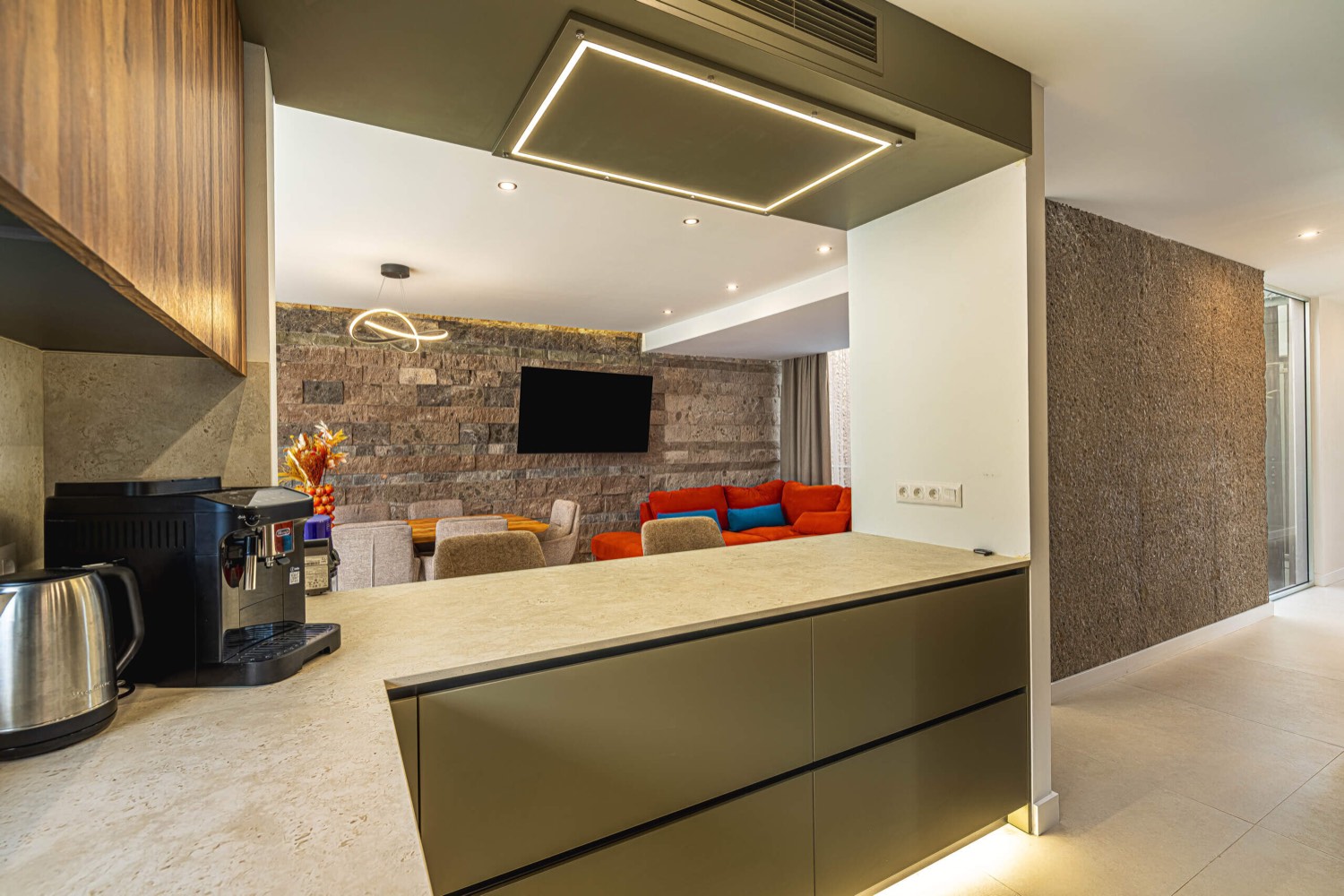 Open-plan living room and kitchen at Villa 32