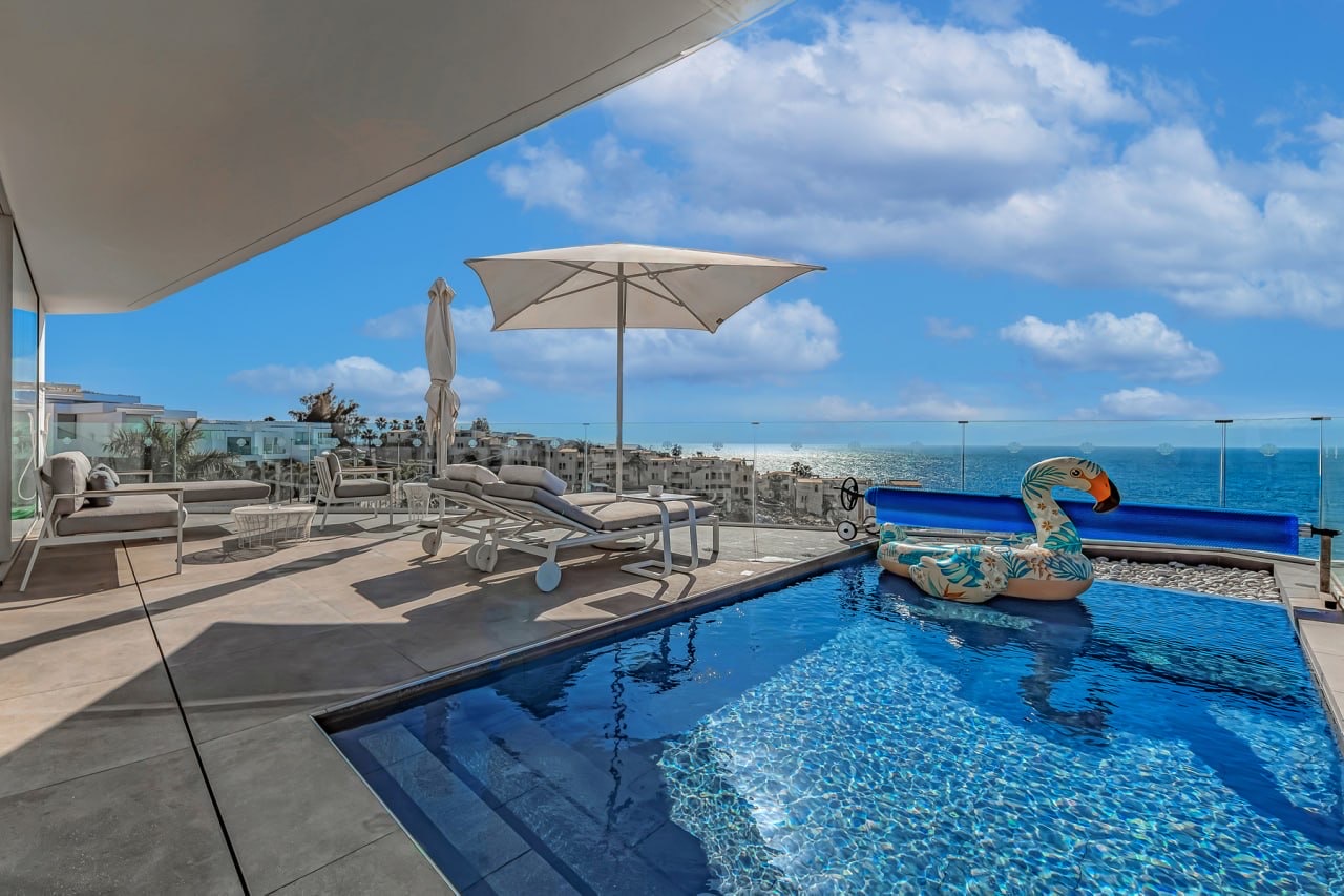 Pool terrace with ocean views at the villa for sale in Rocabella